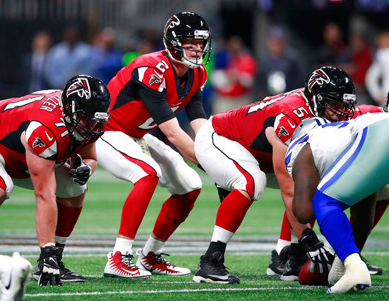 Atlanta Falcons quarterback Matt Ryan (2) looks over the defense of the Dallas Cowboys during an NFL game on Nov. 12 in Atlanta. The Falcons won 27-7. (Jeff Haynes/AP Images for Panini)