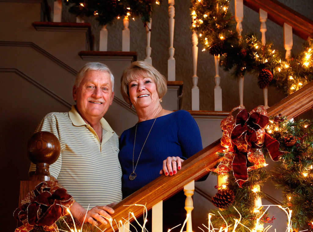 Larry Jubie and his wife Linda, along with Larry’s brother, Harv, and his wife, Jan, will receive the Spirit of Festival Award during the four-day Festival of Trees, a fundraiser for Providence Children’s Services. (Dan Bates / The Herald)

