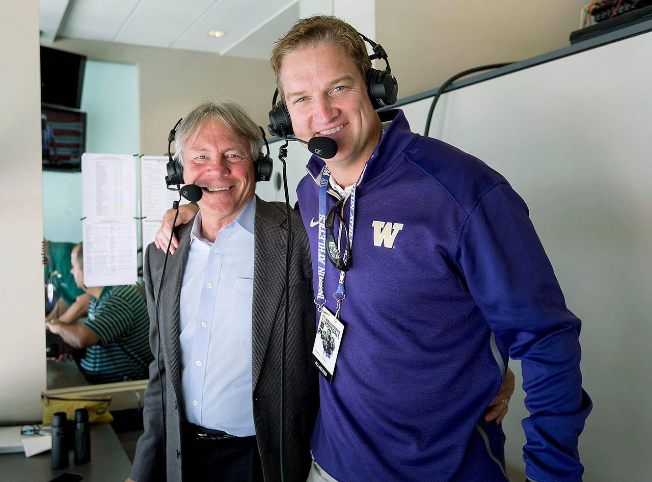 University of Washington play-by-play announcer Bob Rondeau (left) poses with color commentator Damon Huard during a broadcast of the Huskies’ football game against Sacramento State on Sept. 12, 2015. (Scott Eklund/Red Box Pictures)