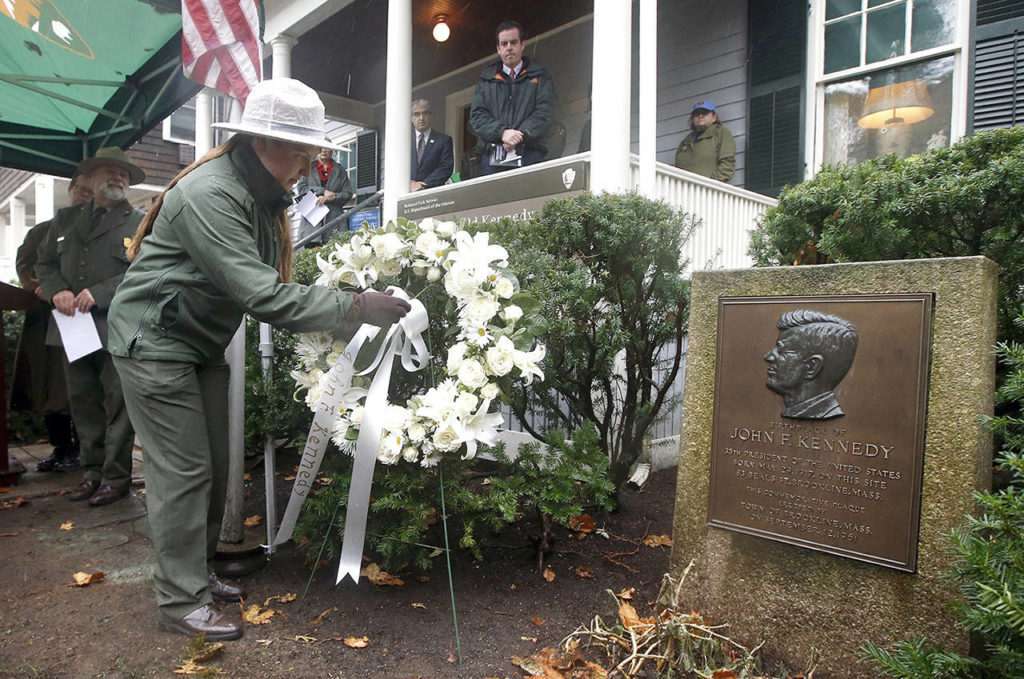 A National Park Ranger places a wreath outside John F. Kennedy’s childhood home in Brookline, Massachusetts, on Wednesday, the 54th anniversary of Kennedy’s assassination in Dallas in 1963. (AP Photo/Michael Dwyer)
