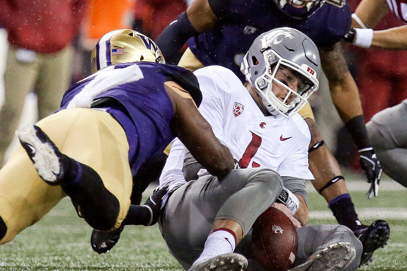 Apple Cup notebook: Huskies’ 3-man front pressures Falk into mistakes