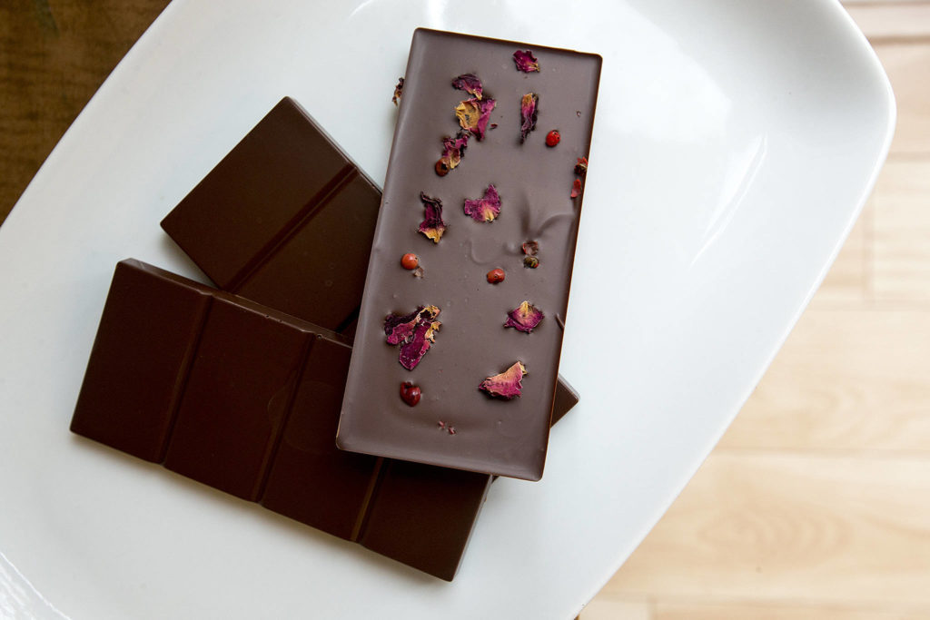 A test batch of Church Street Chocolate’s rose petal and pink peppercorn chocolate bars are seen. (Ian Terry / The Herald)
