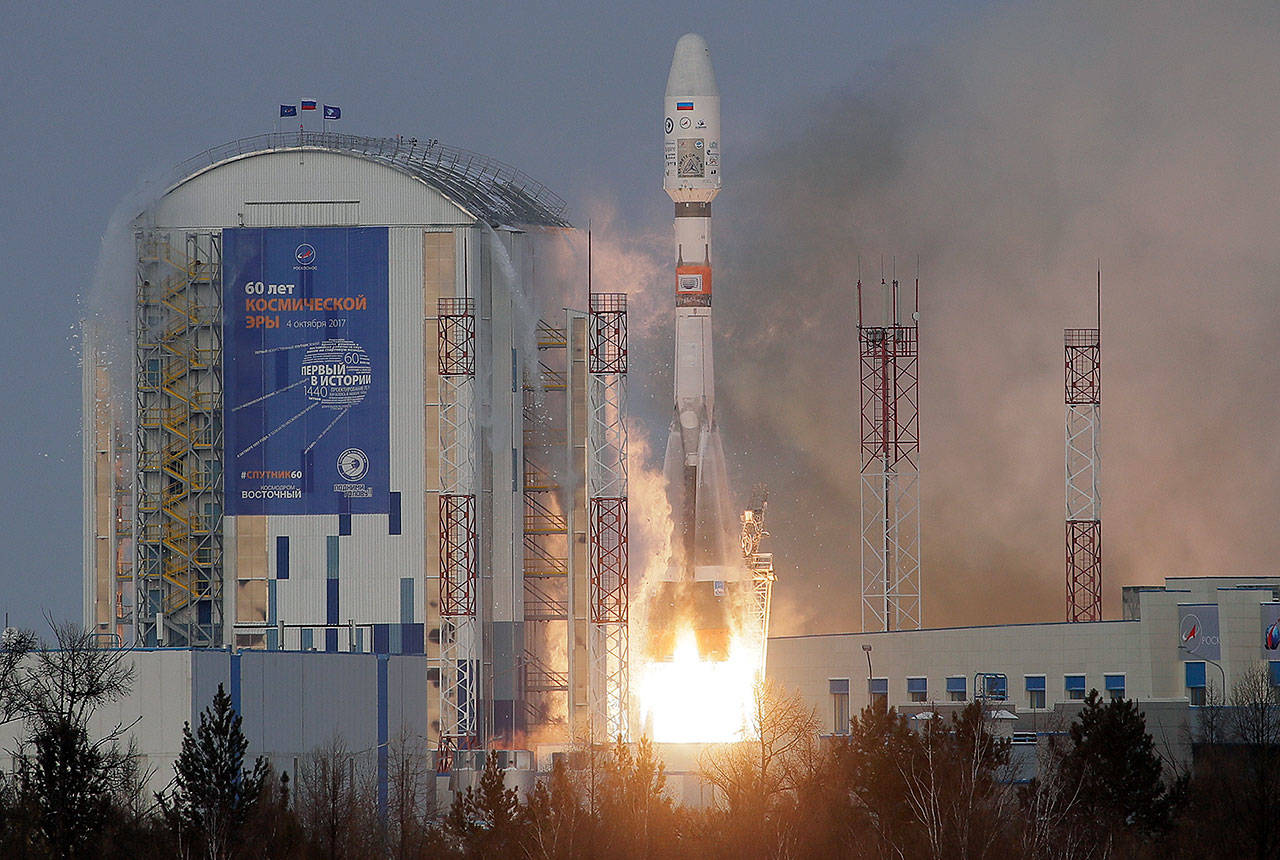 A Russian Soyuz 2.1b rocket, carrying Meteor M satellite and additional 18 small satellites, lifts off from the launch pad at the new Vostochny cosmodrome outside the city of Tsiolkovsky in Russia on Tuesday. (AP Photo/Dmitri Lovetsky)