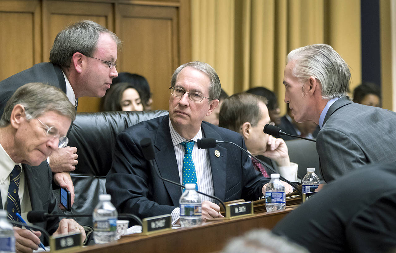 House Judiciary Committee Chairman Bob Goodlatte, R-Va. (center) is joined by (from left) Rep. Lamar Smith, R-Texas, a staff aide, and Rep. Trey Gowdy, R-S.C. (far right) as the panel meets to craft a Republican bill to expand gun owners’ rights, the first gun legislation since mass shootings in Las Vegas and Texas killed more than 80 people, on Capitol Hill in Washington on Wednesday. (AP Photo/J. Scott Applewhite)