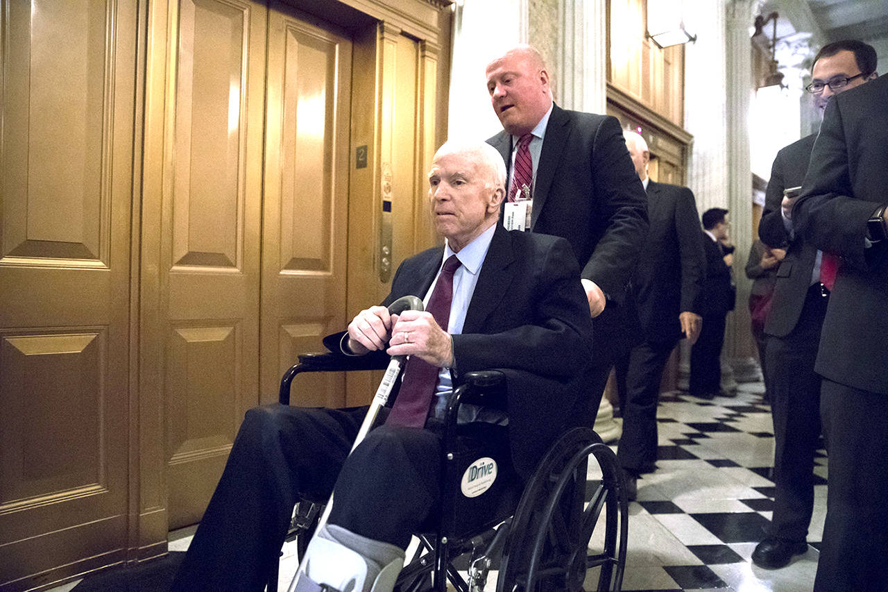 Senate Armed Services Chairman John McCain, R-Ariz., arrives for votes on Capitol Hill in Washington on Monday evening. (AP Photo/J. Scott Applewhite)