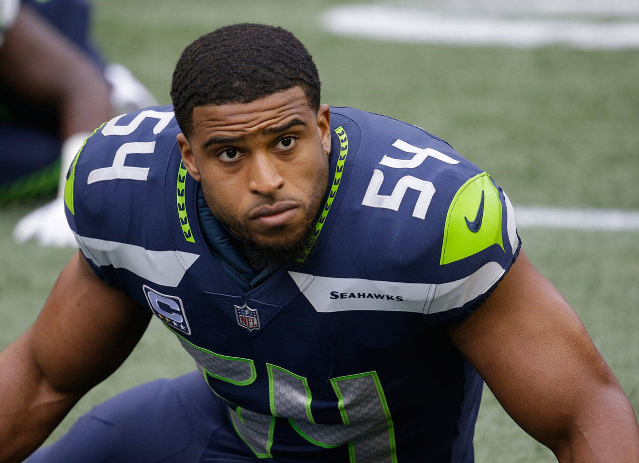 Seahawks middle linebacker Bobby Wagner stretches before a game against the Rams on Dec. 17, 2017, in Seattle. (AP Photo/Elaine Thompson)