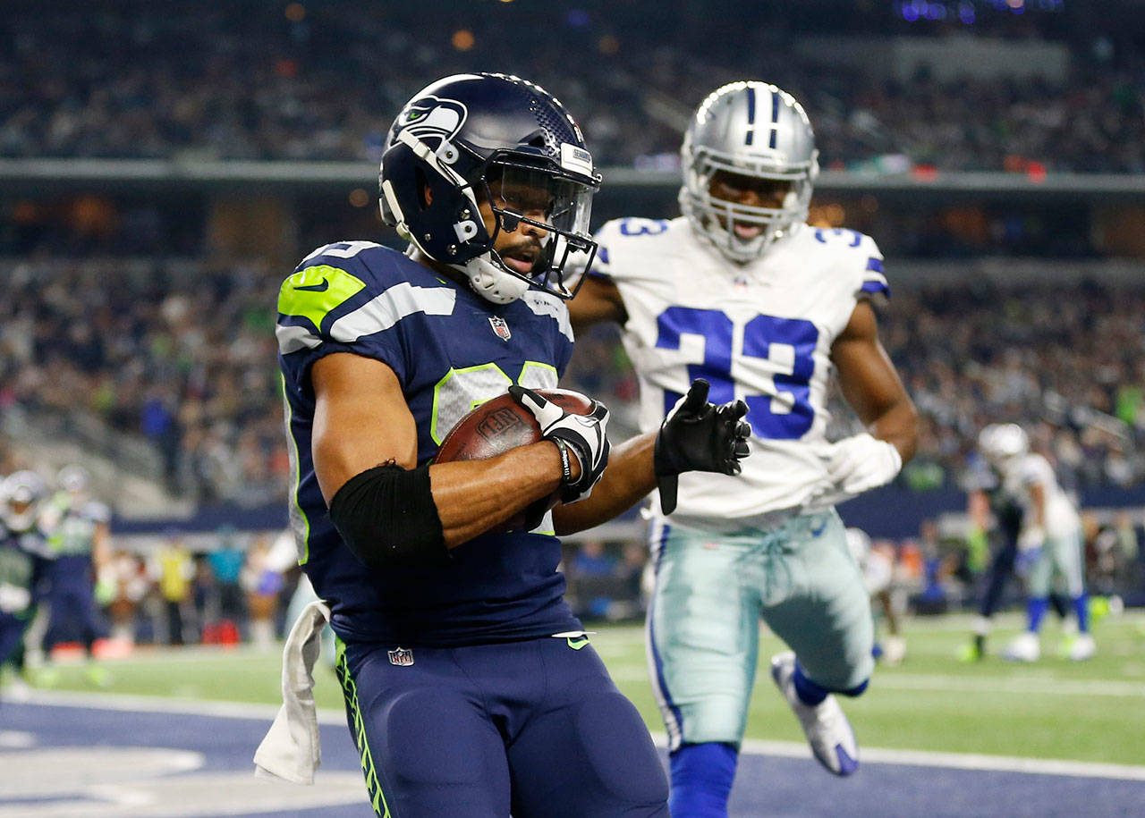 Seahawks wide receiver Doug Baldwin (89) catches a touchdown pass in front of the Cowboys’ Chidobe Awuzie (33) in the second half of a game Dec. 24, 2017, in Arlington, Texas. (AP Photo/Ron Jenkins)
