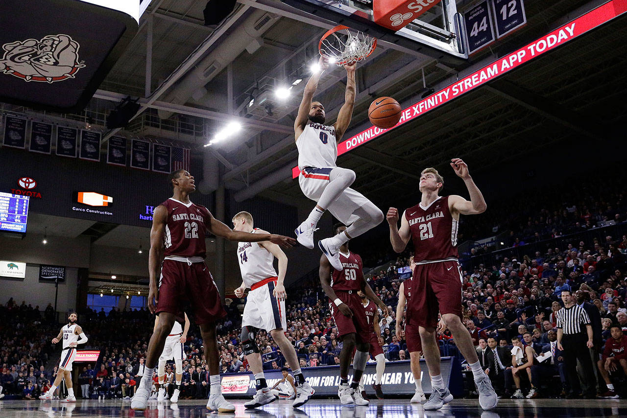 Gonzaga’s Silas Melson dunks during the first half of Saturday’s game in Spokane. (AP Photo/Young Kwak)