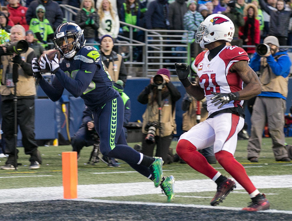 Seahawks wide receiver Doug Baldwin makes a touchdown reception past Cardinals corner back Patrick Peterson Sunday afternoon at CenturyLink Field in Seattle on December 31, 2017. Seattle lost 26-24. (Kevin Clark / The Daily Herald)
