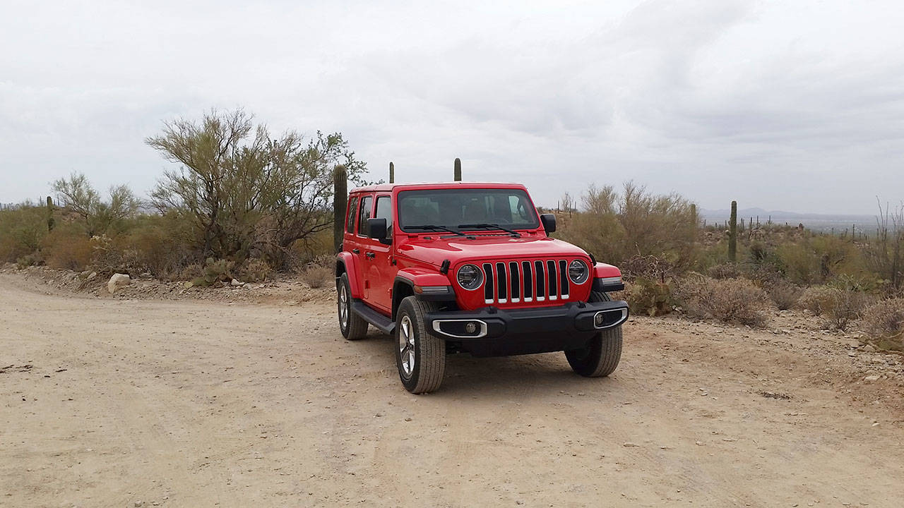 On the 2018 Wrangler, Jeep’s trademark seven-slot grille has been updated. It now shows both of the outer grille slats intersecting with the headlights. (Mary Lowry)