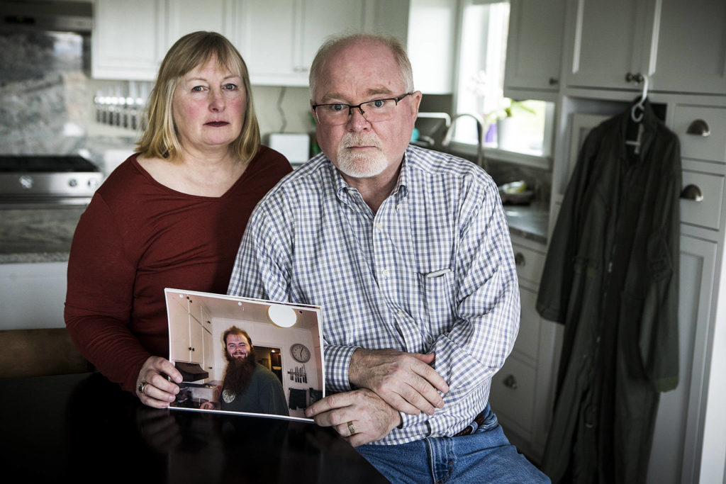 Juliann and Erik Olson’s son, Garrett, a mechanic at Boeing, was killed in July of 2014 when he lost control of his motorcycle after trying to evade police near Smokey Point. (Ian Terry / The Herald)
