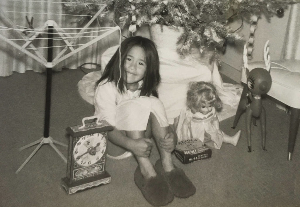 Sue Misao, age 4 or 5-ish, with her befuddling Christmas presents at her home in Monrovia, California. (June Christensen)
