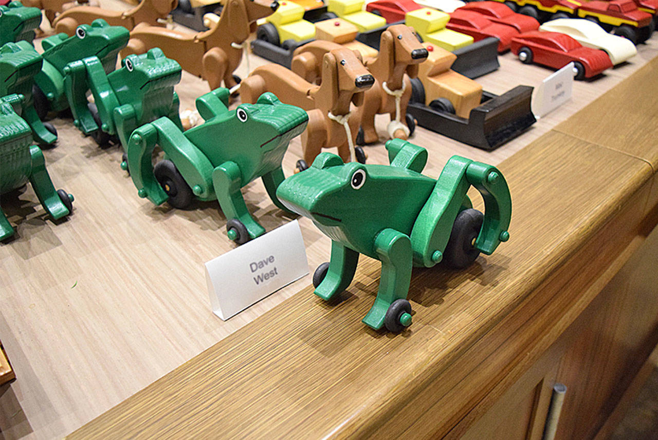 Frogs that roll are one of the toys made by Emerald Heights Retirement Community residents. The residents build the toys from cutoff hardwoods and plywoods donated by Monroe’s Canyon Creek Cabinet Company. (Contributed photo)