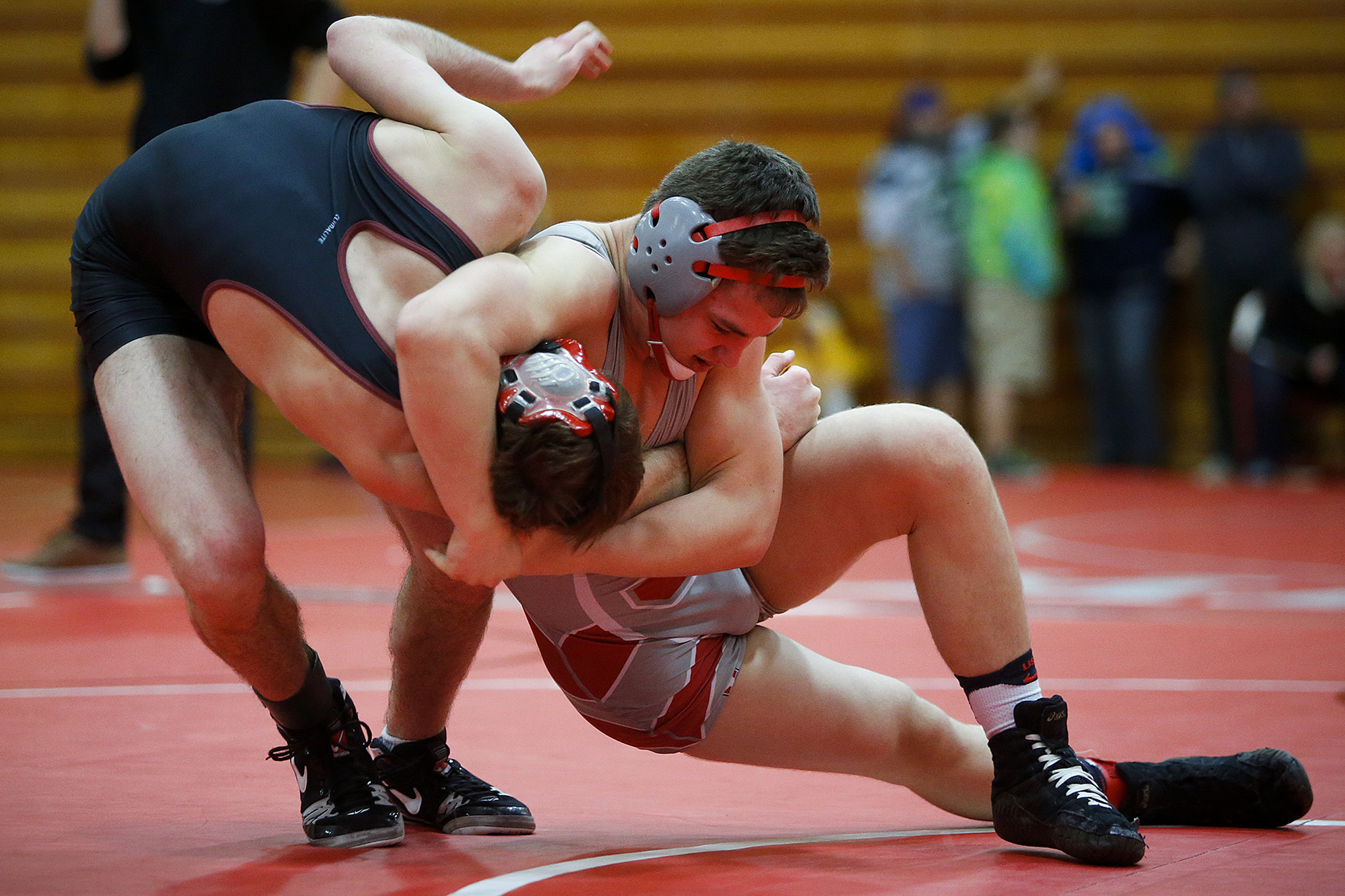 Stanwood’s Riley Van Scoy (right), takes down Bethel’s Quincy Osterlund on the way to winning the 145-pound weight class at the Marysville Pilchuck Premier Wrestling Tournament in January. (Ian Terry / The Herald)