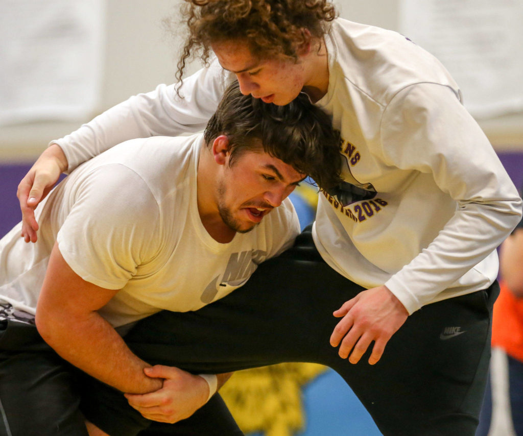 Lake Stevens’ Malachi Lawrence (left) wrestles teammate Julian Fryberg during practice on Nov. 29, 2017, at Lake Stevens High School. (Kevin Clark / The Herald)
