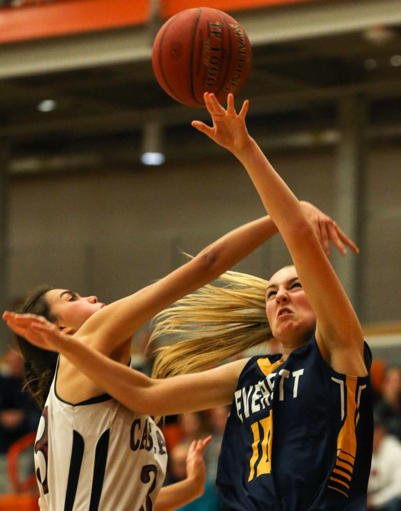 Everett’s Morgan Carter (right) is fouled by Cascade’s Brooke Alcayaga during the Seagulls’ 50-23 win over Cascade on Friday night during Bru-Gull Fest at Everett Community College. (Kevin Clark / The Herald)
