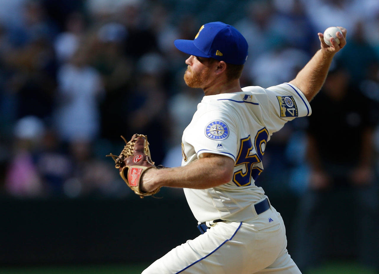 Seattles Shae Simmons throws during Sept. 3 game at Safeco Field. (AP Photo/Ted S. Warren)