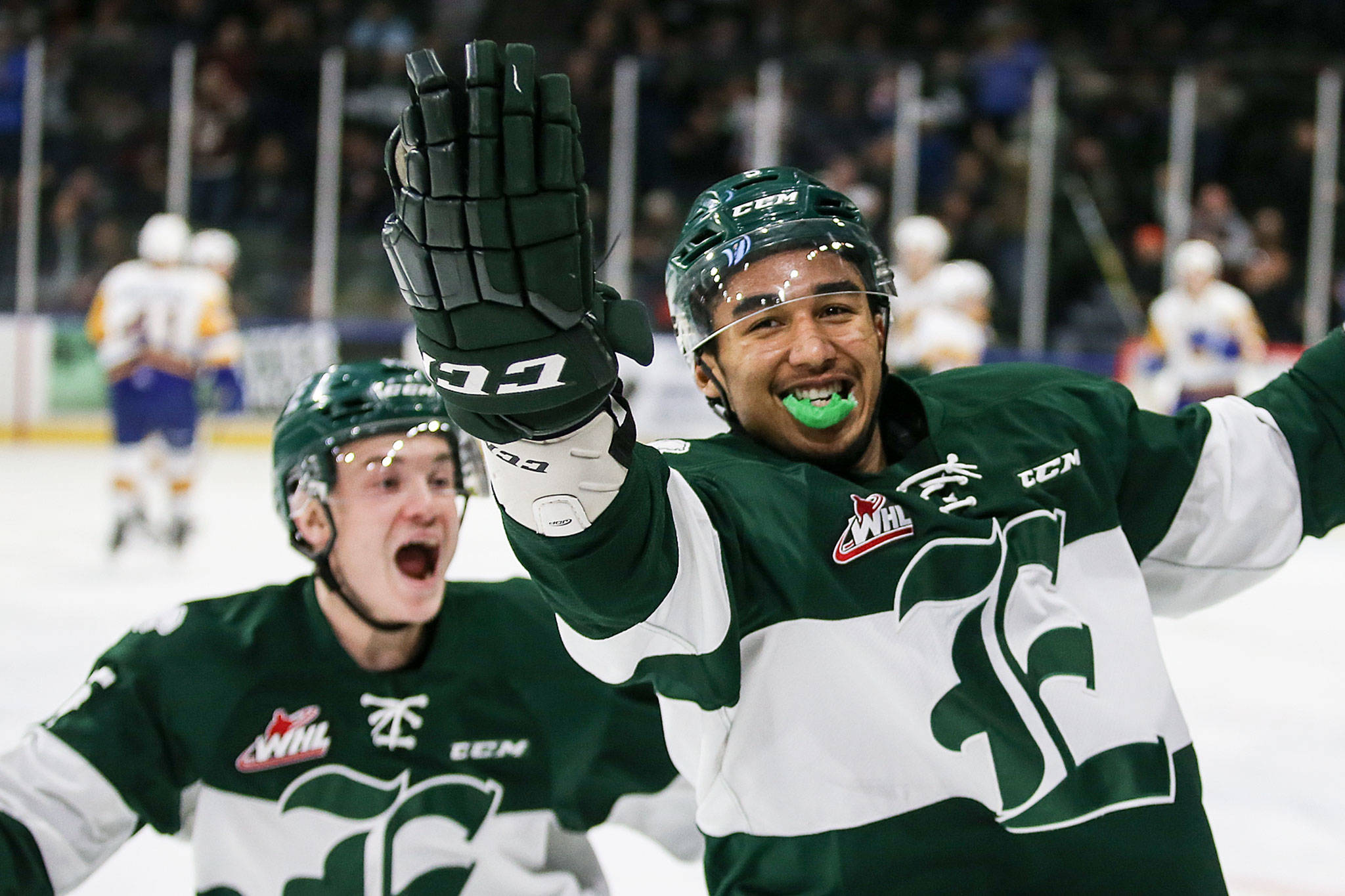 Everett’s Montana Onyebuchi, right, celebrates his goal with Everett’s Sean Richards trailing in the first period Saturday night at Xfinity Arena in Everett on December 2, 2017. (Kevin Clark / The Herald)