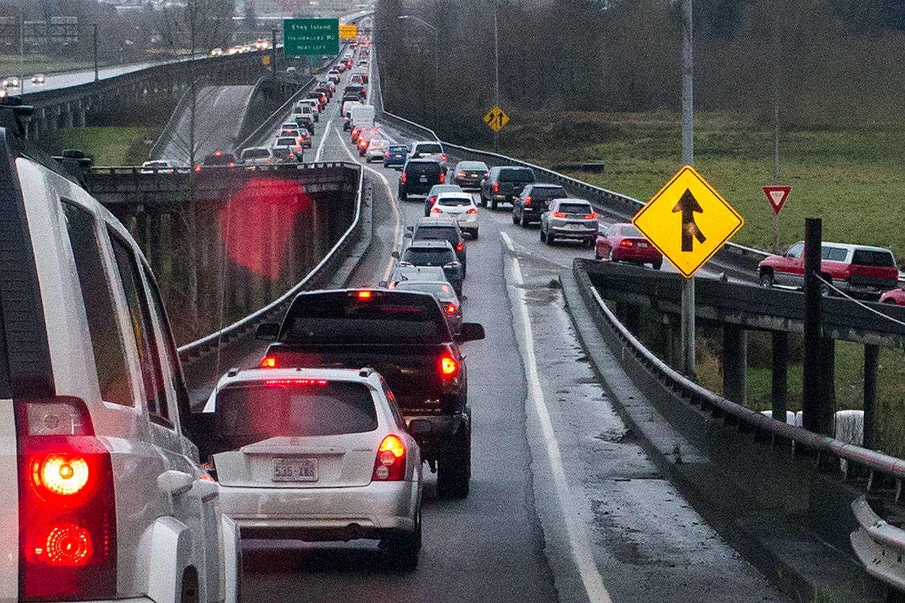 Ian Terry / The Herald Westbound cars merge from Highway 204 and 20th Street Southeast onto the trestle during the morning commute on Thursday, March 30 in Lake Stevens. Photo taken on 03302017