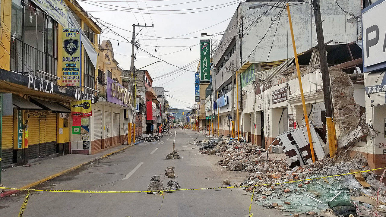 Rubble sprawls across a street in Mexico City after an earthquake struck the region in September. Everett’s Reid Middleton engineers traveled to the city to help with recovery efforts, but also to learn how to prevent damage from future quakes. (Courtesy of Reid Middleton)