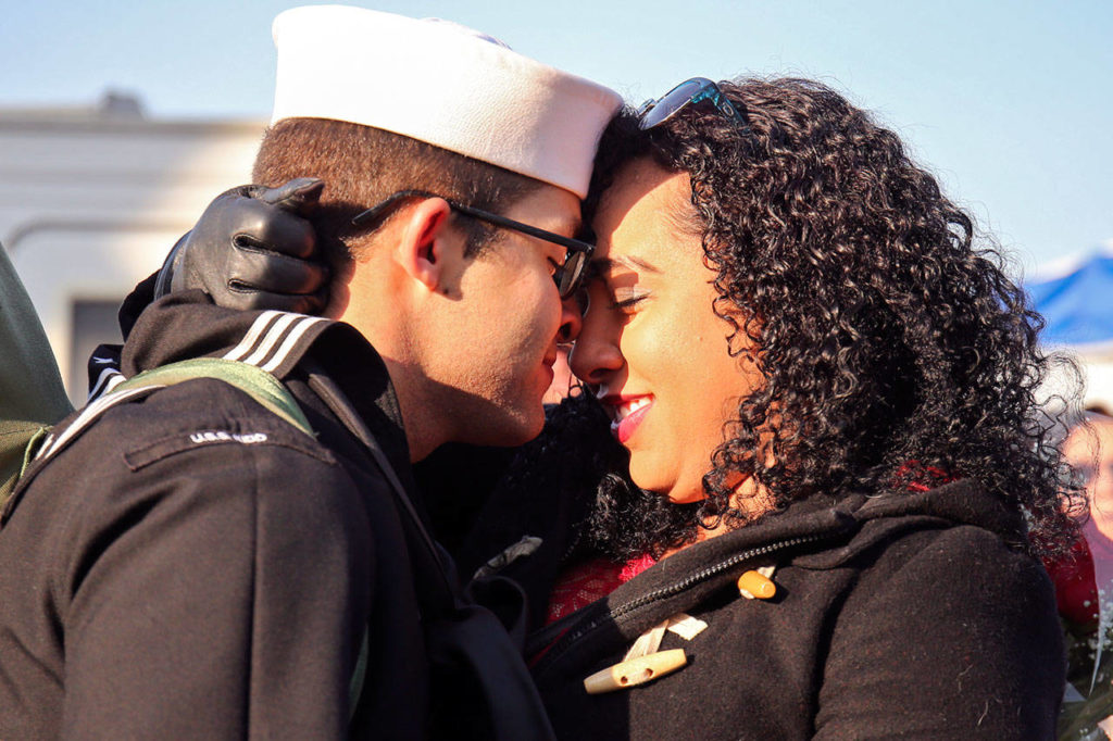 Jacob Connelly is welcomed home by Susan Mean on Sunday morning at Naval Station Everett. (Kevin Clark / The Herald)

