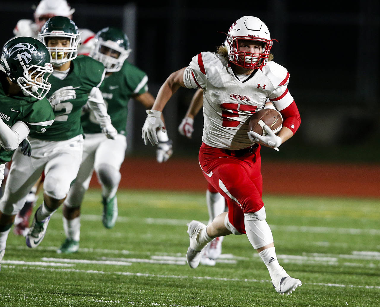 Snohomish’s Keegan Stich (right) breaks free and runs for a touchdown during a game against Edmonds-Woodway on Oct. 27, 2017, at Edmonds Stadium. (Ian Terry / The Herald)