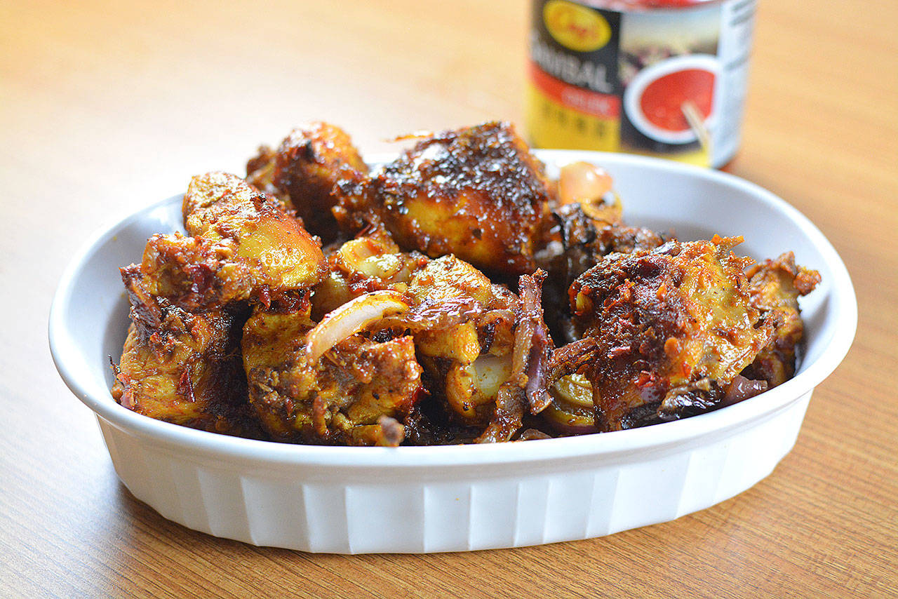 Sambal is a spicy chili-based sauce or paste that cooks well with chicken, beef or seafood. Here it flavors chunks of dark-meat chicken. (Reshma Seetharam)