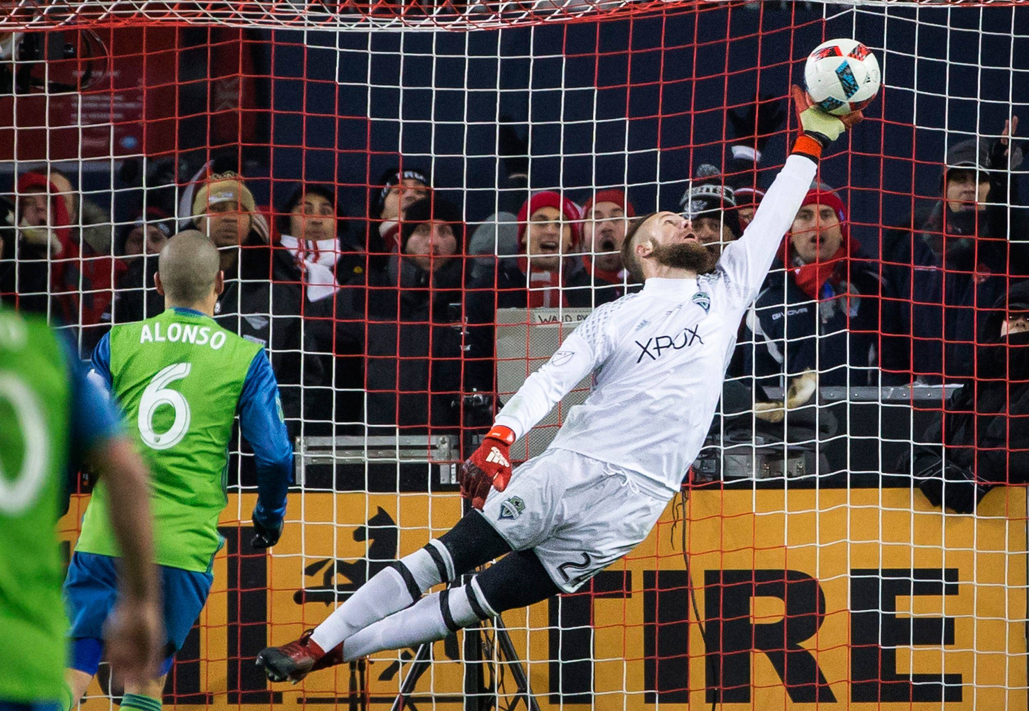 Seattle Sounders goalkeeper Stefan Frei makes a one-handed save on a shot by Toronto FC forward Jozy Altidore during the 2016 MLS Cup on Dec. 10, 2016, at BMO Field in Toronto. (Lindsey Wasson/The Seattle Times via AP)