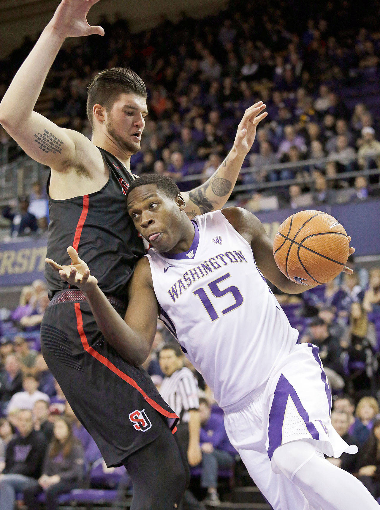 Washington’s Noah Dickerson (15) tries to maneuver around Seattle’s Aaron Menzies during a Nov. 24 game in Seattle. Dickerson and the Huskies take on No. 2 Kansas on Wednesday. (AP Photo/Elaine Thompson)