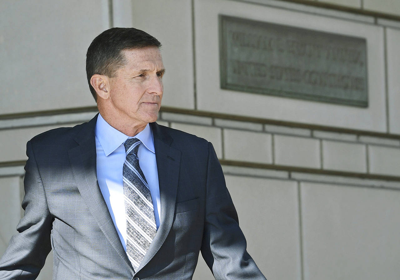 In this Dec. 1 photo, former Trump national security adviser Michael Flynn leaves federal court in Washington. (AP Photo/Susan Walsh)