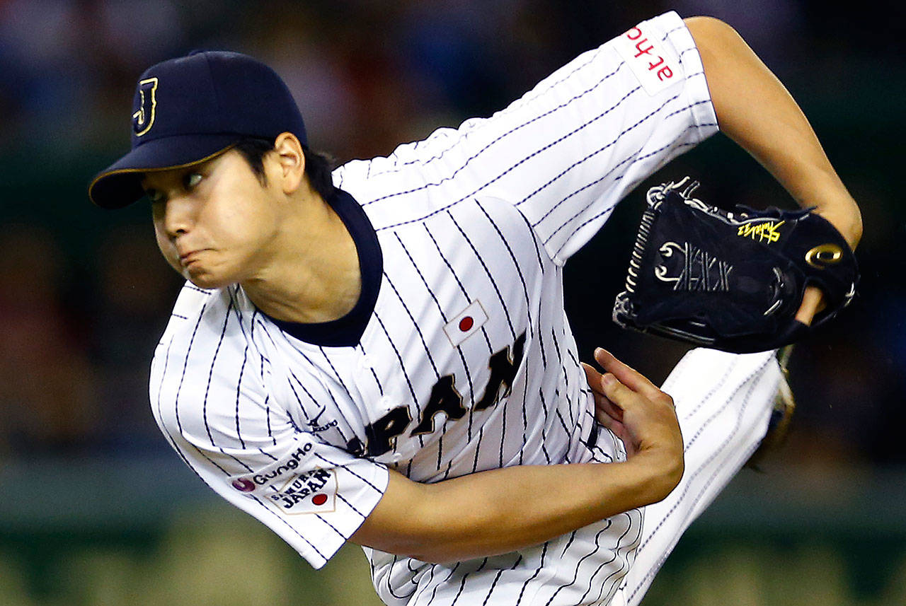 Japan’s Shohei Ohtani pitches against South Korea during the first inning of a Premier12 world baseball tournament game on Nov. 19, 2015, at the Tokyo Dome. (AP Photo/Shizuo Kambayashi)
