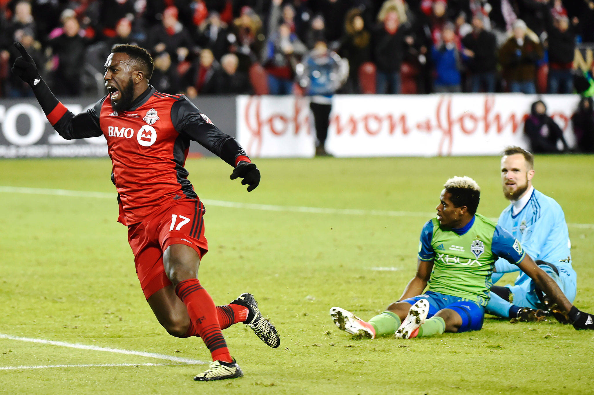 Toronto FC forward Jozy Altidore (17) celebrates after scoring against Sounders goalkeeper Stefan Frei (right) as defender Joevin Jones looks on during the second half of the MLS Cup final on Dec. 9, 2017, in Toronto. (Nathan Denette/The Canadian Press)