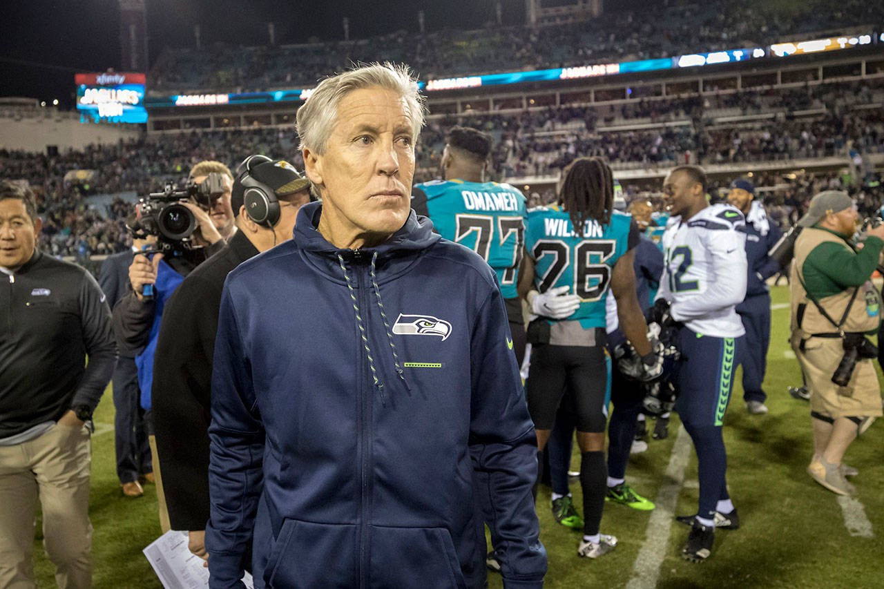 Seattle Seahawks head coach Pete Carroll walks off the field after Sunday’s 30-24 loss to the Jaguars in Jacksonville, Florida. (AP Photo/Stephen B. Morton)