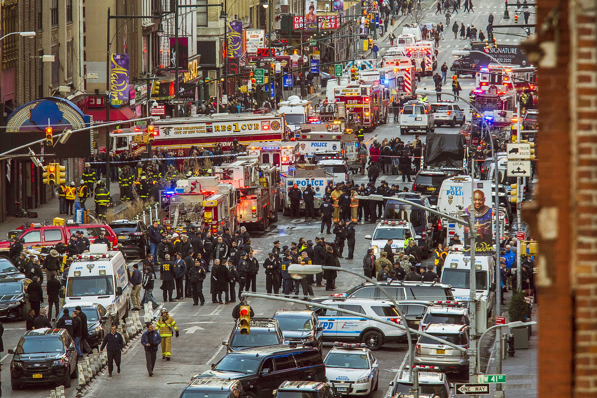 Law enforcement officials work following an explosion near New York’s Times Square on Monday. (AP Photo/Andres Kudacki)