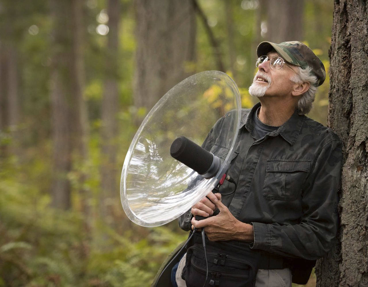 Bob Jepperson carries a parabolic dish sound recorder on some of his hikes through the woods.