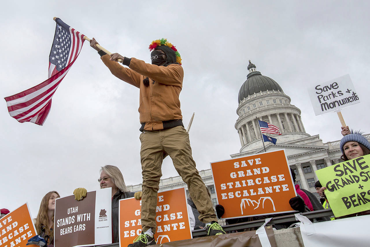 In this Dec. 4 photo, protesters gathered outside of the Utah State Capitol where President Donald Trump was speaking to local representatives in Salt Lake City. (Benjamin Zack/Standard-Examiner via AP, file)