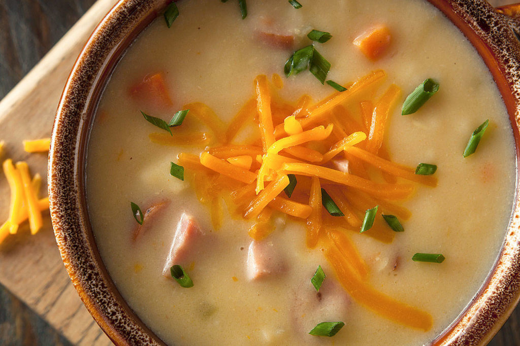This soup is made with chunks of potatoes, a nut brown ale, chopped green onions and two kinds of cheese. (Thinkstock)

