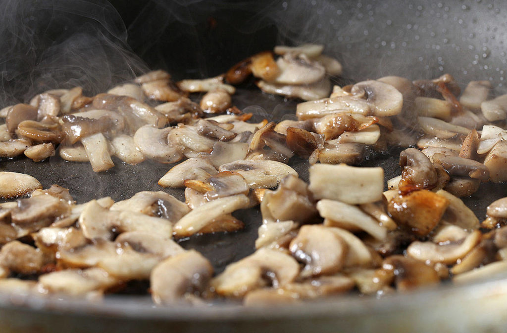 Once you add the ‘shrooms to the pan, don’t touch them until they begin to brown. (Abel Uribe/Chicago Tribune)
