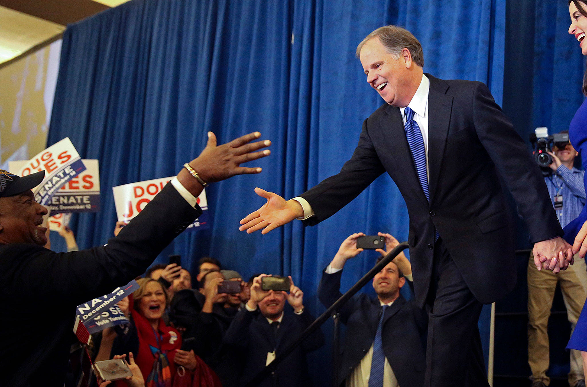 Doug Jones is greeted by a supporter before speaking during an election-night party Tuesday in Birmingham, Alabama. (AP Photo/John Bazemore)