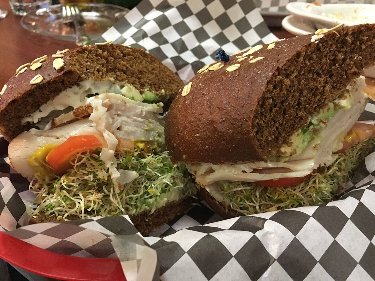 Christa’s Sandwichboard’s Christacado features sliced turkey, avocado, alfalfa sprouts, tomato, onion, lettuce, mayonnaise and mustard on sweet bread. (Ben Watanabe / The Herald)
