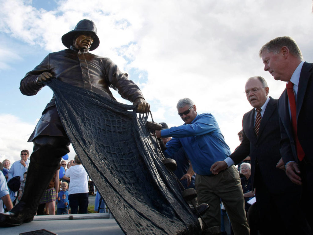 The Fisherman’s Tribute Statue was unveiled at the Port of Everett’s Waterfront Center on June 23, 2011, and many were there for the dedication, including elected officials such as Everett Mayor Ray Stephanson (right). (Herald file)
