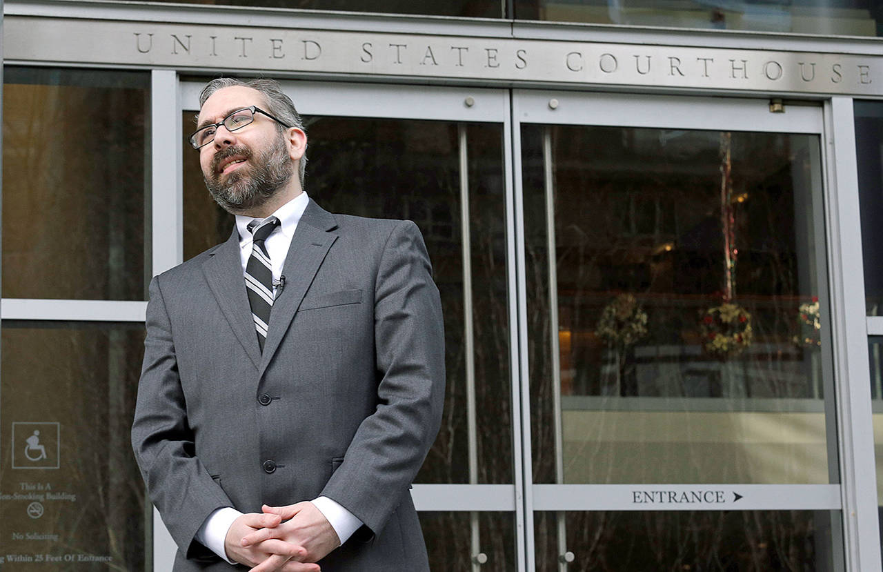 Democratic presidential elector Bret Chiafalo stands outside the U.S. Courthouse before a 2016 hearing in Seattle. (AP Photo/Elaine Thompson, file)