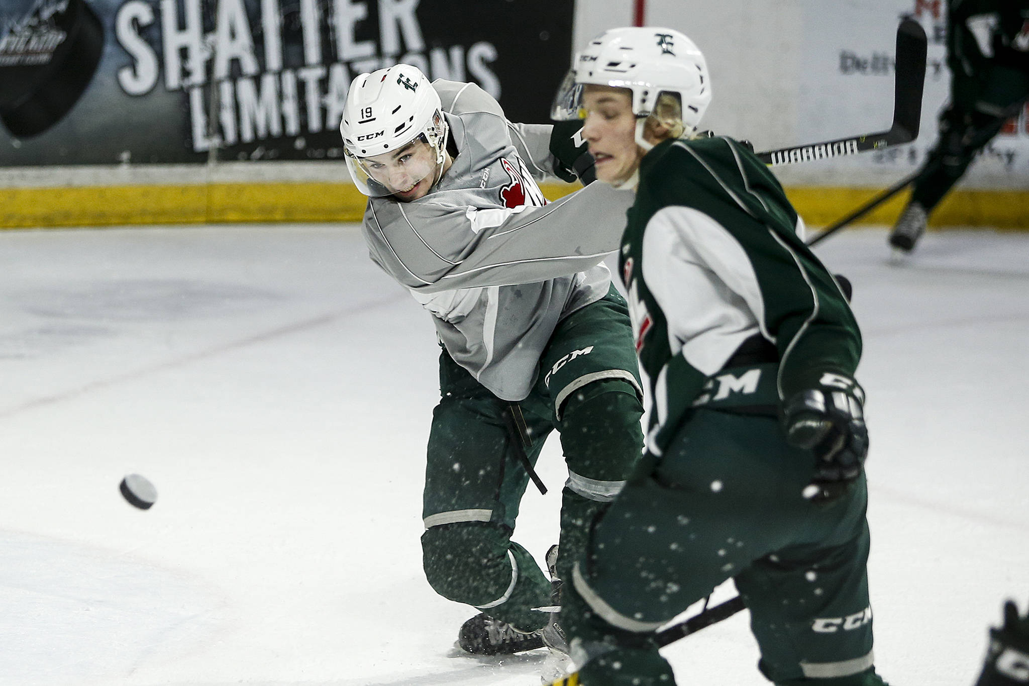 Silvertips winger Bryce Kindopp (left) takes a shot during practice on Dec. 13, 2017, at Angel of the Winds Arena in Everett. (Ian Terry / The Herald)