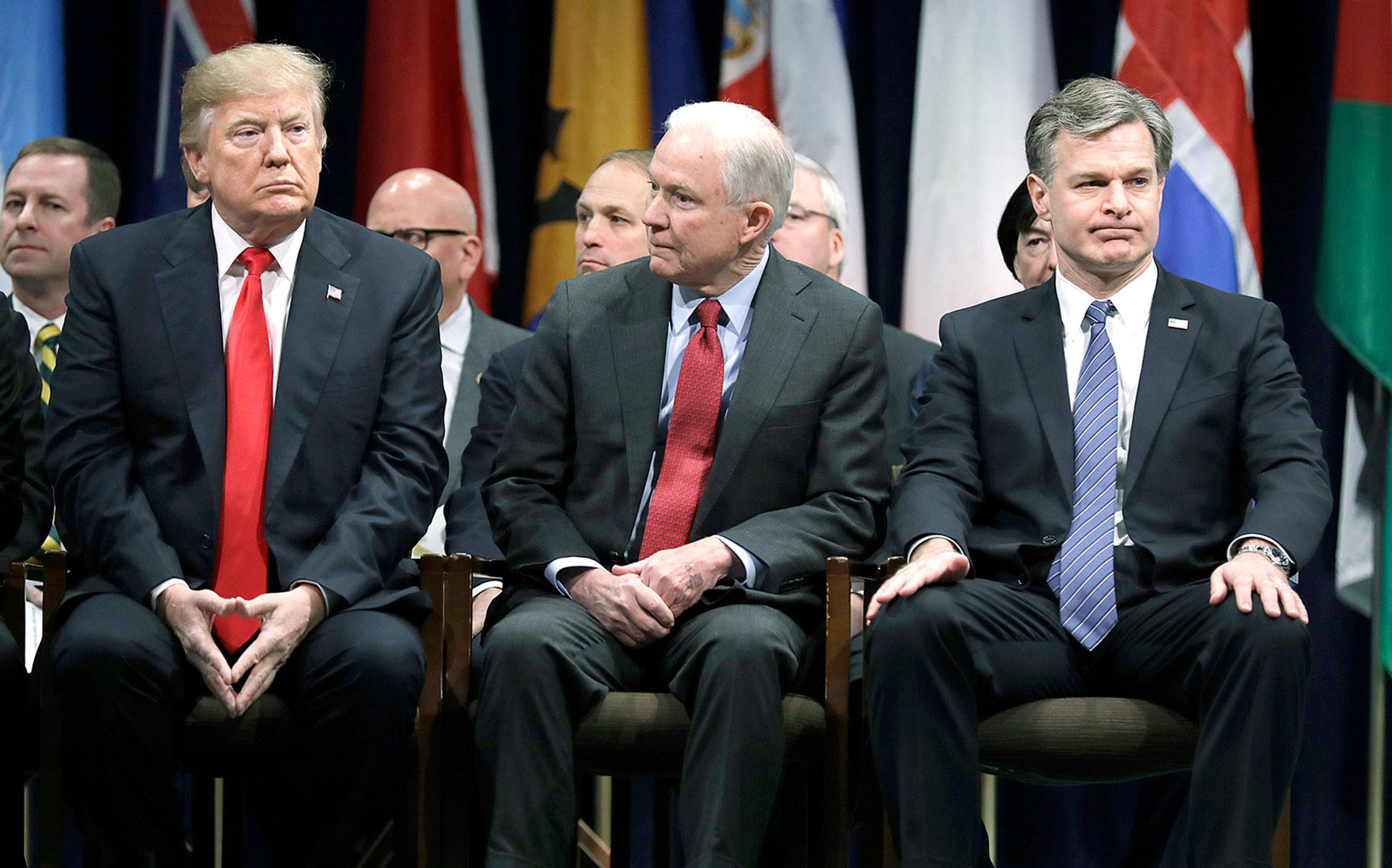 President Donald Trump, Attorney General Jeff Sessions (center) and FBI Director Christopher Wray (right) at the FBI National Academy graduation ceremony on Friday in Quantico, Virginia. (AP Photo/Evan Vucci)