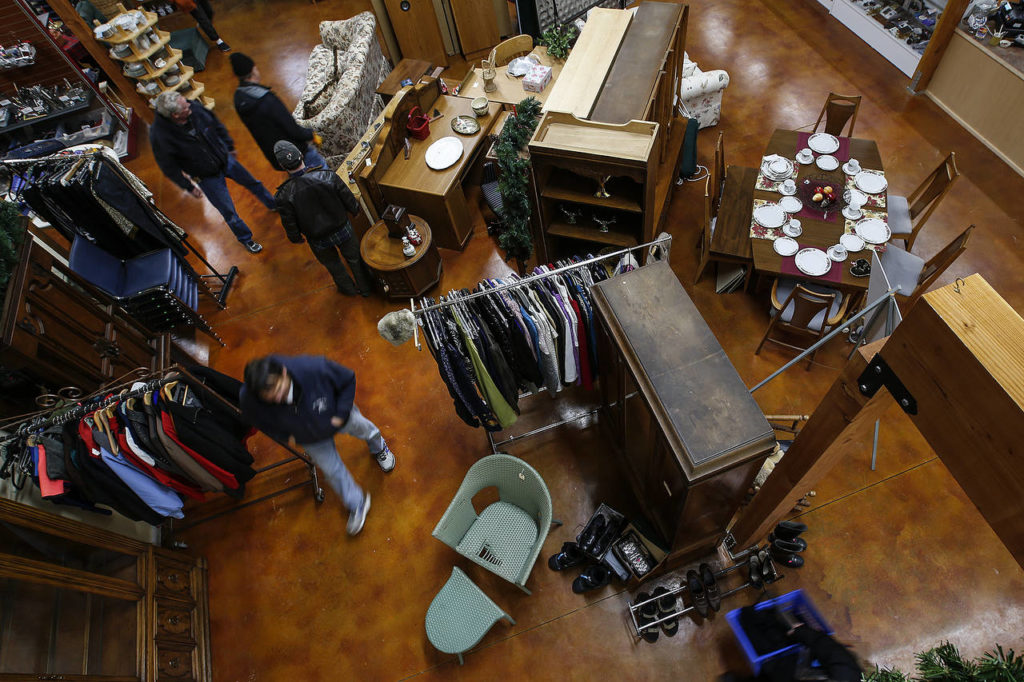 Customers wander through Second Chance Thrift Shop’s new building on Camano Island on Thursday. (Ian Terry / The Herald)
