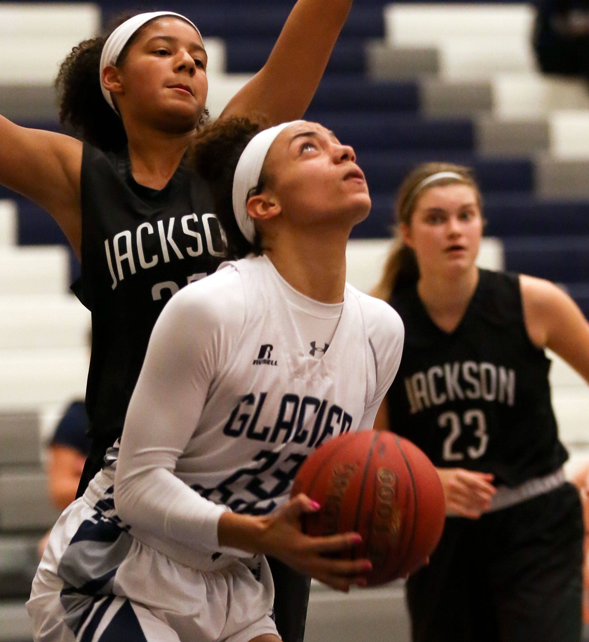 Glacier Peak’s Alexyss Newman looks for a shot with Jackson’s Olivia Skibiel defending during a game Dec. 15, 2017, at Glacier Peak High School in Snohomish. (Kevin Clark / The Daily Herald)