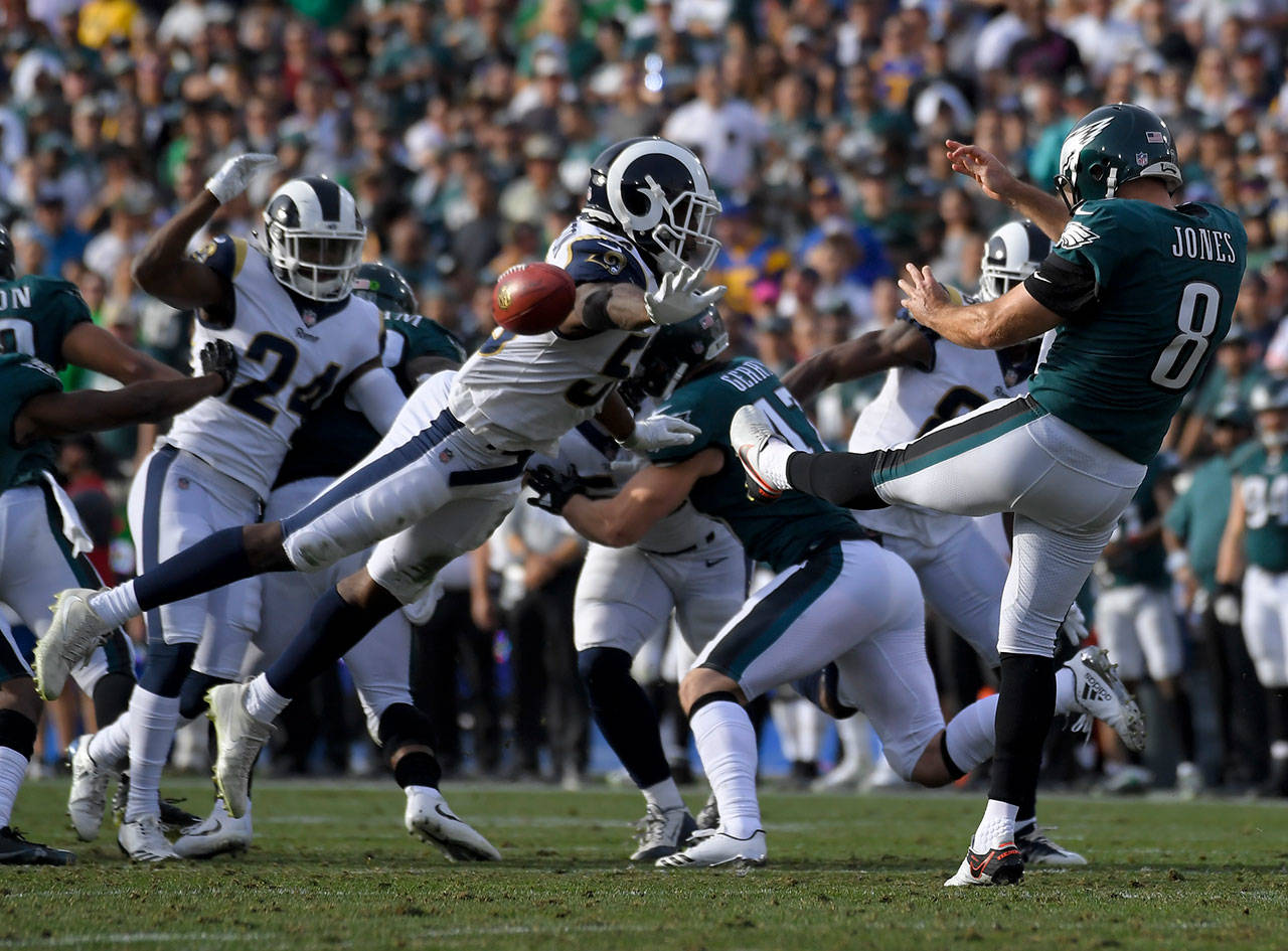 Rams middle linebacker Cory Littleton (left) blocks a punt by the Eagles’ Donnie Jones during the first half of a game Dec. 10, 2017, in Los Angeles. (AP Photo/Mark J. Terrill)