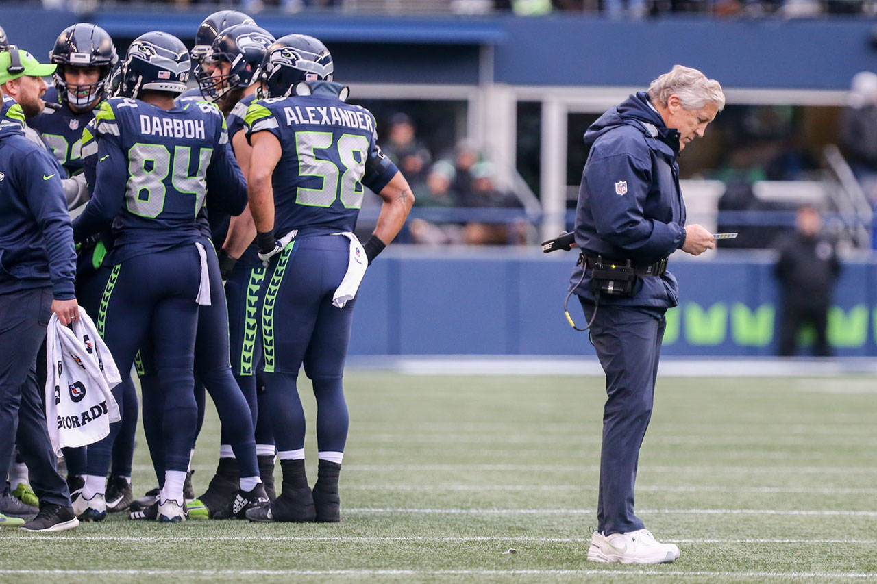 Seahawks head coach Pete Carroll (right) and his staff earned their lowest grade of the season for Sunday’s 42-7 loss to the Rams. (Kevin Clark / The Daily Herald)