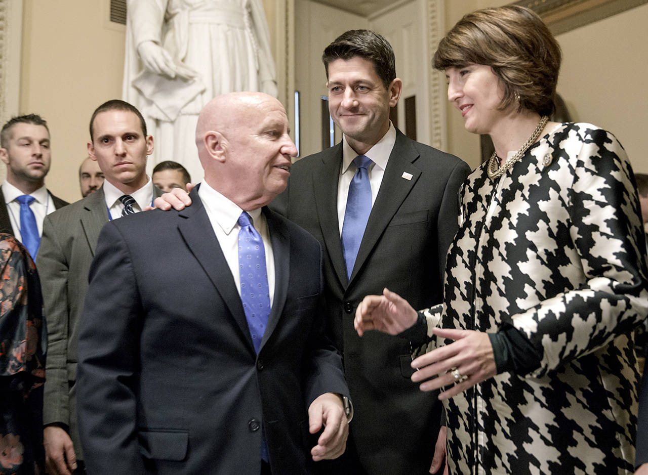 From left, House Ways and Means Committee Chairman Kevin Brady, R-Texas, Speaker of the House Paul Ryan, R-Wis., and Rep. Cathy McMorris Rodgers, R-Wash., chair of the Republican Conference, prepare to speak to reporters after passing the GOP tax reform bill in the House of Representatives, on Capitol Hill in Washington on Tuesday. (AP Photo/J. Scott Applewhite)
