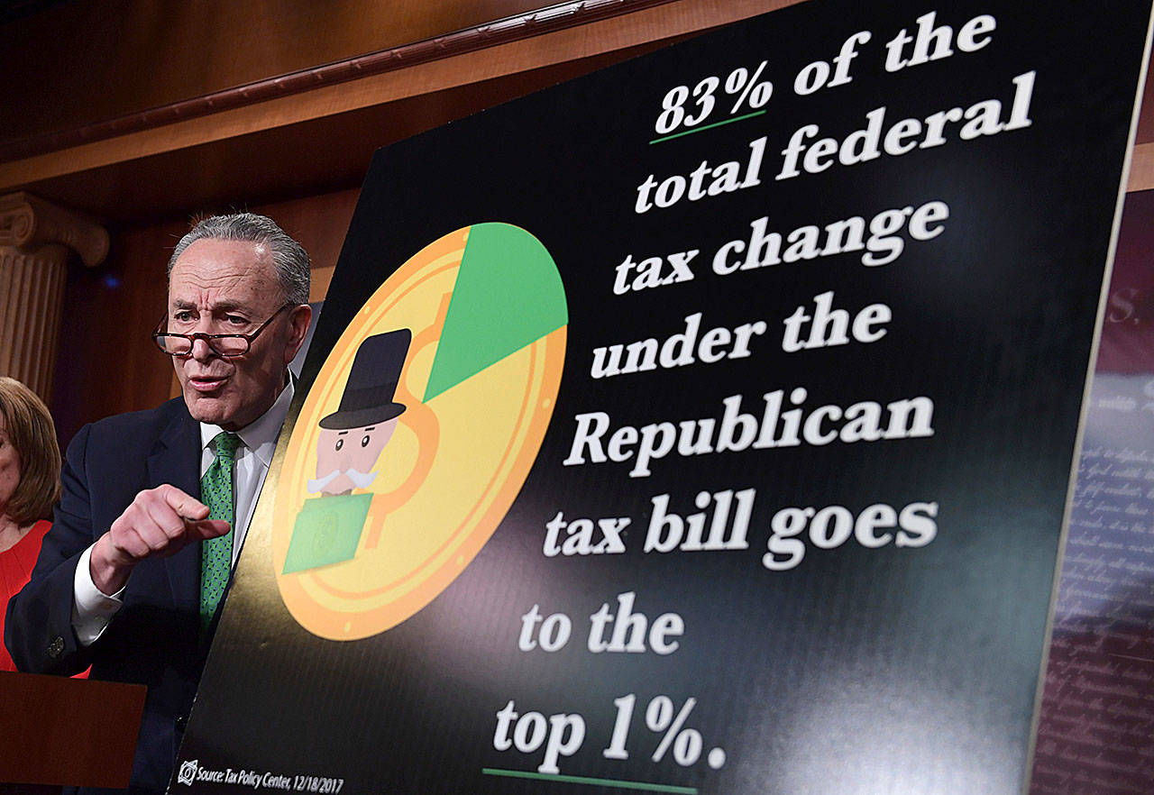 Senate Minority Leader Sen. Chuck Schumer, D-N.Y., speaks at a news conference on Capitol Hill on Wednesday. The massive $1.5 trillion tax package affects everyone’s taxes but is dominated by breaks for business and higher earners. (AP Photo/Susan Walsh)